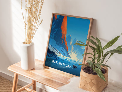 Framed Baffin Island wall art showcasing a sunrise over majestic mountains, with adventurers in winter gear traversing snowy terrain.
