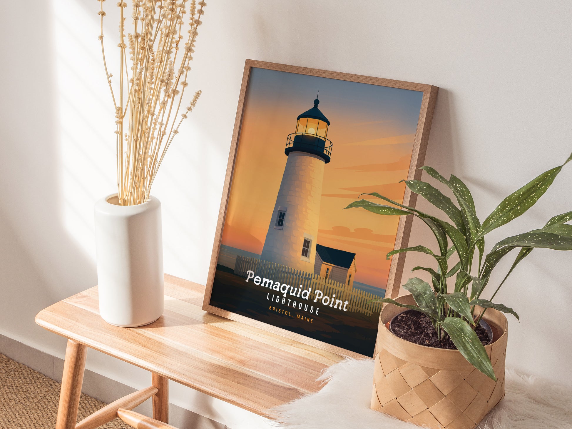 Pemaquid Lighthouse in Bristol, Maine at sunset, showcasing warm orange and pink skies, ideal travel art for coastal decor.