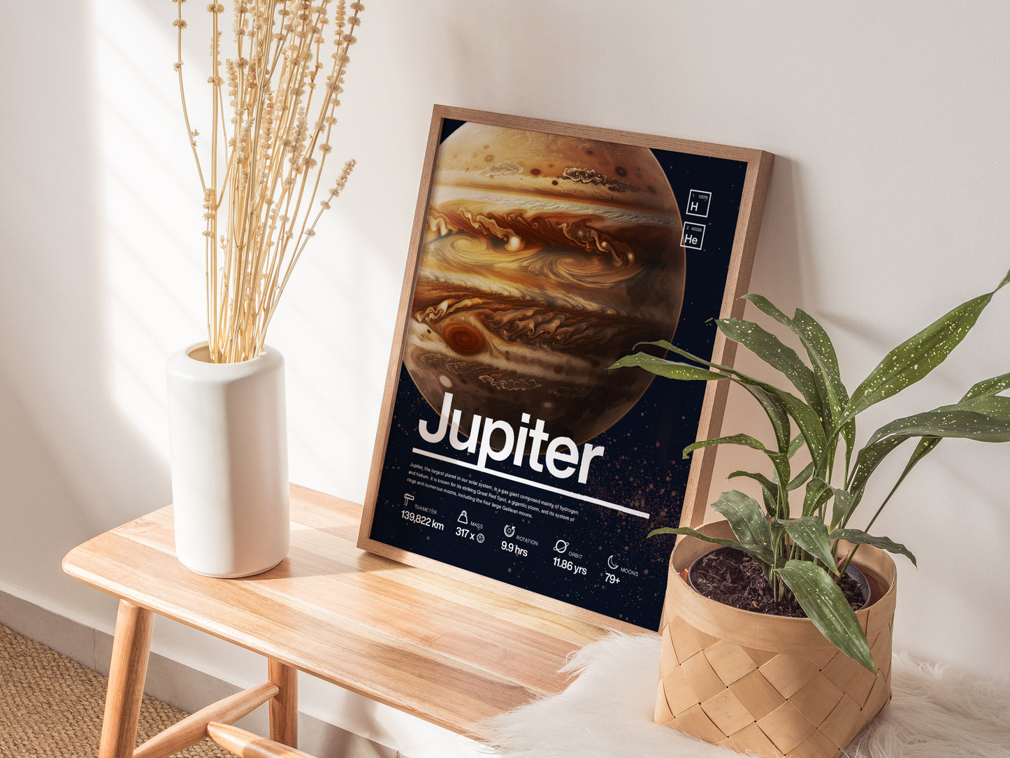 A framed poster of Jupiter with detailed planetary features is displayed on a wooden bench, alongside a white vase with dried plants and a potted green plant.