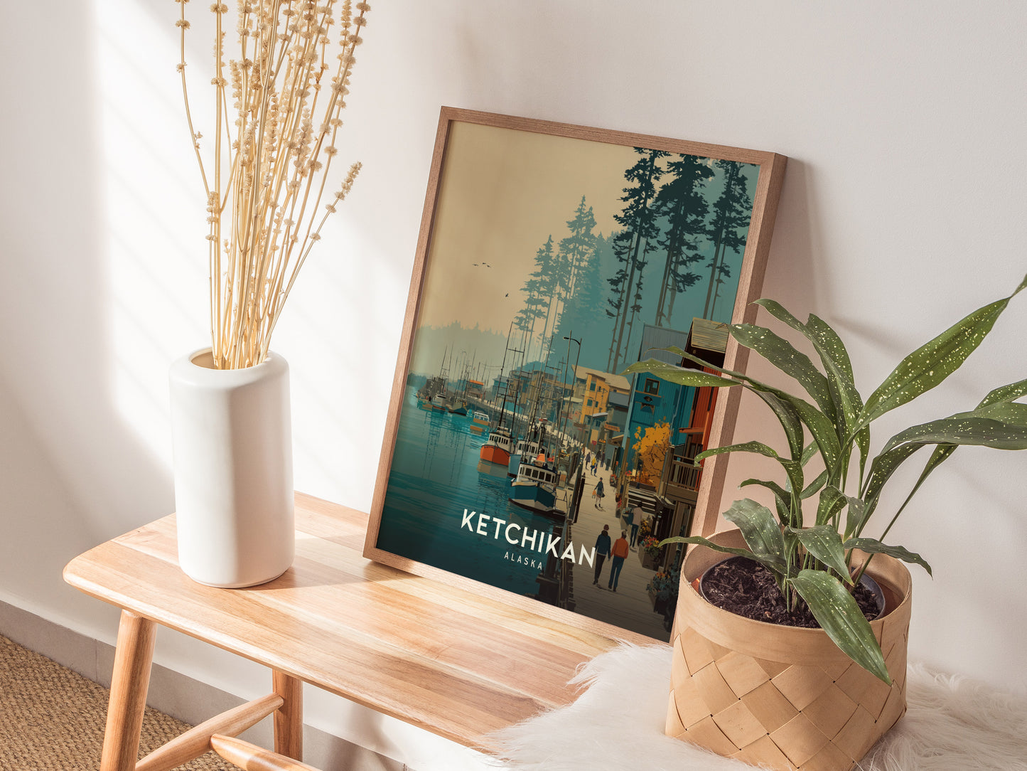 Framed travel print showcasing Ketchikan, Alaska's colorful waterfront, boats, and vibrant buildings amidst serene nature.