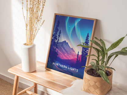A framed Northern Lights Alaska poster rests on a wooden bench, accompanied by a white vase with dried flowers and a potted green plant, in a softly lit room.