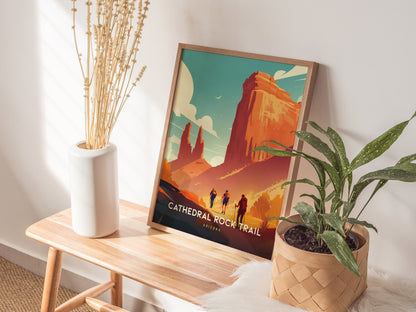 A framed Cathedral Rock Trail poster rests on a wooden bench beside a white vase with dried flowers and a potted green plant, creating a serene, natural atmosphere.