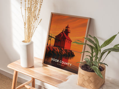 Framed Door County art print featuring a red lighthouse at sunset, with vibrant orange skies and calm waters, perfect for travel art lovers.