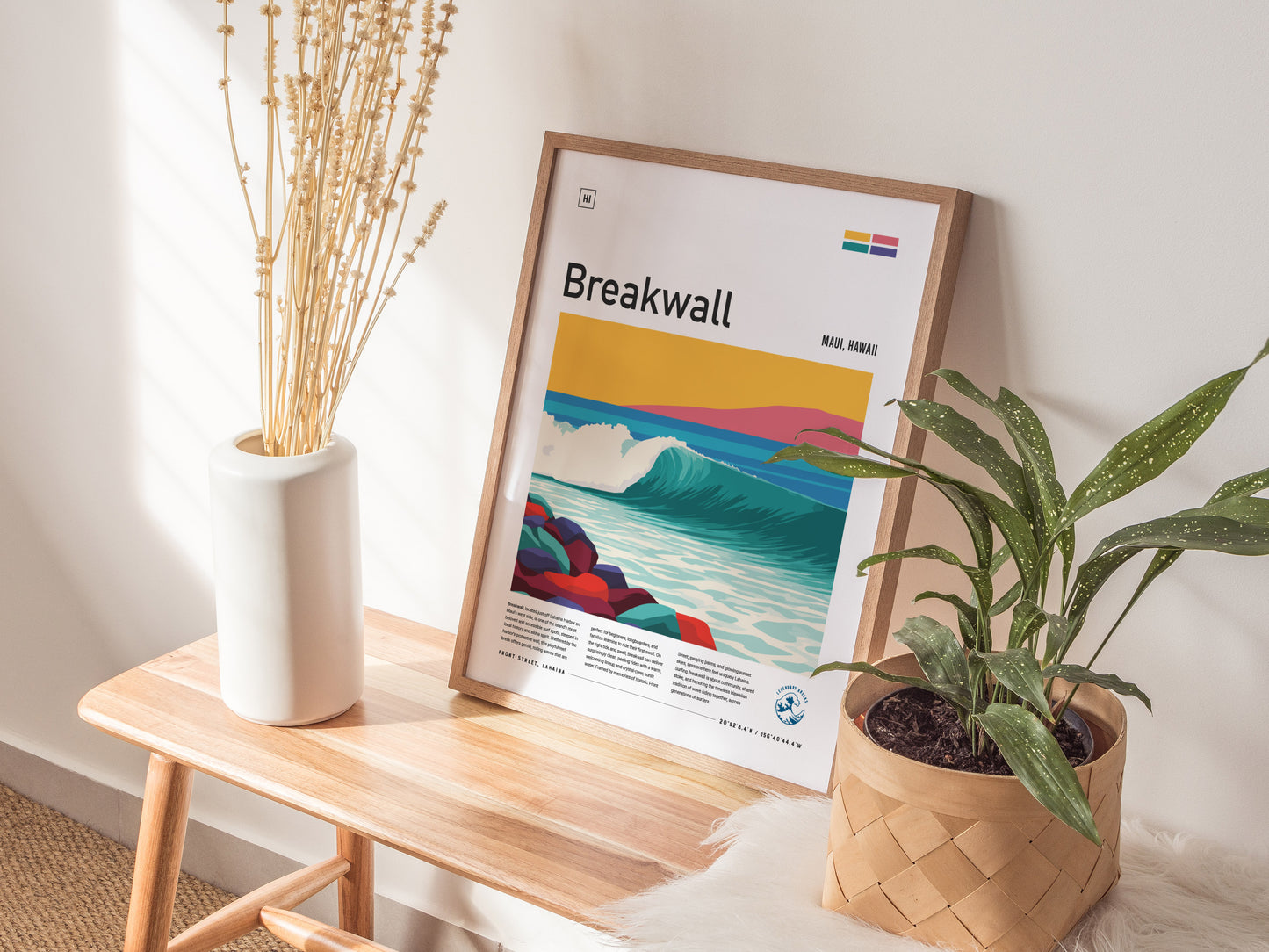 Vibrant Breakwall Maui poster featuring a stylized ocean wave, colorful rocks, and a bright yellow sky, perfect surf decor.