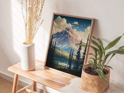 A framed Jasper National Park poster sits on a wooden bench beside a vase with dried flowers and a potted plant, creating a cozy and natural decor setting.