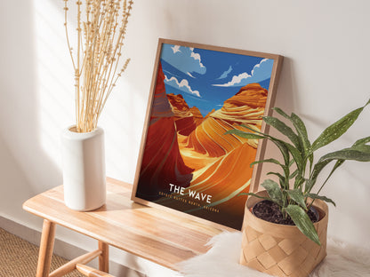 A framed poster of The Wave in Coyote Buttes, Arizona, rests on a wooden bench beside a white vase with dried stems and a potted plant.