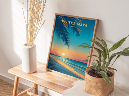 A colorful Riviera Maya travel poster is displayed on a wooden bench, surrounded by a tall white vase with dried branches and a potted green plant.