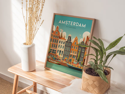 A framed Amsterdam poster with colorful canal houses is displayed on a wooden bench, alongside a white vase with dried flowers and a potted plant.