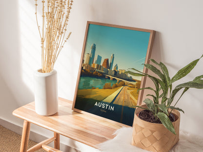 A poster depicting the Austin, Texas skyline rests on a wooden bench, accompanied by a white vase with dried flowers and a green potted plant.