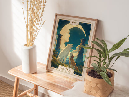 A tarot card poster titled The Moon featuring a crescent moon, two howling wolves, and ancient pillars, is displayed on a wooden table next to a vase and a potted.