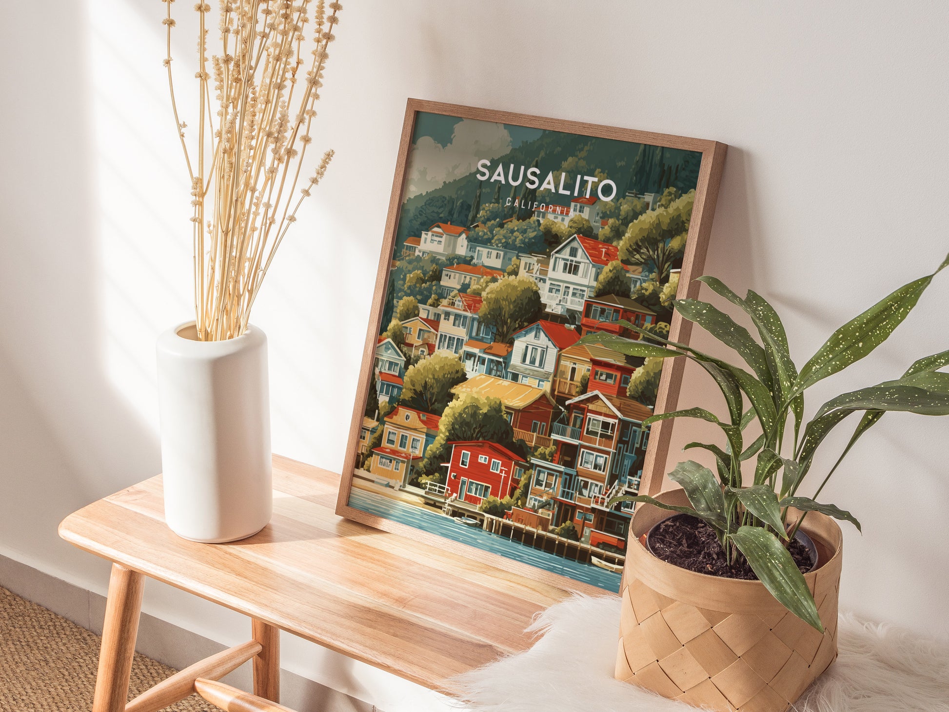 Framed vintage Sausalito, California poster showcasing colorful hillside homes, vibrant coastal art print for travel enthusiasts.