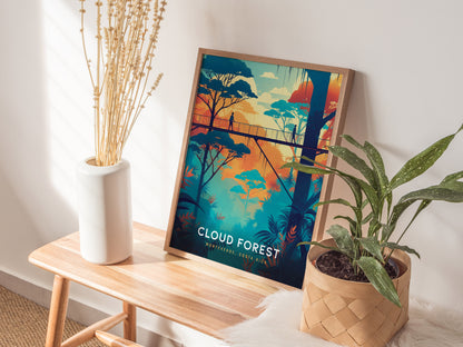 A colorful poster of Costa Ricas Cloud Forest, featuring a canopy walkway, is propped on a wooden bench beside a white vase with dried stems and a leafy plant.