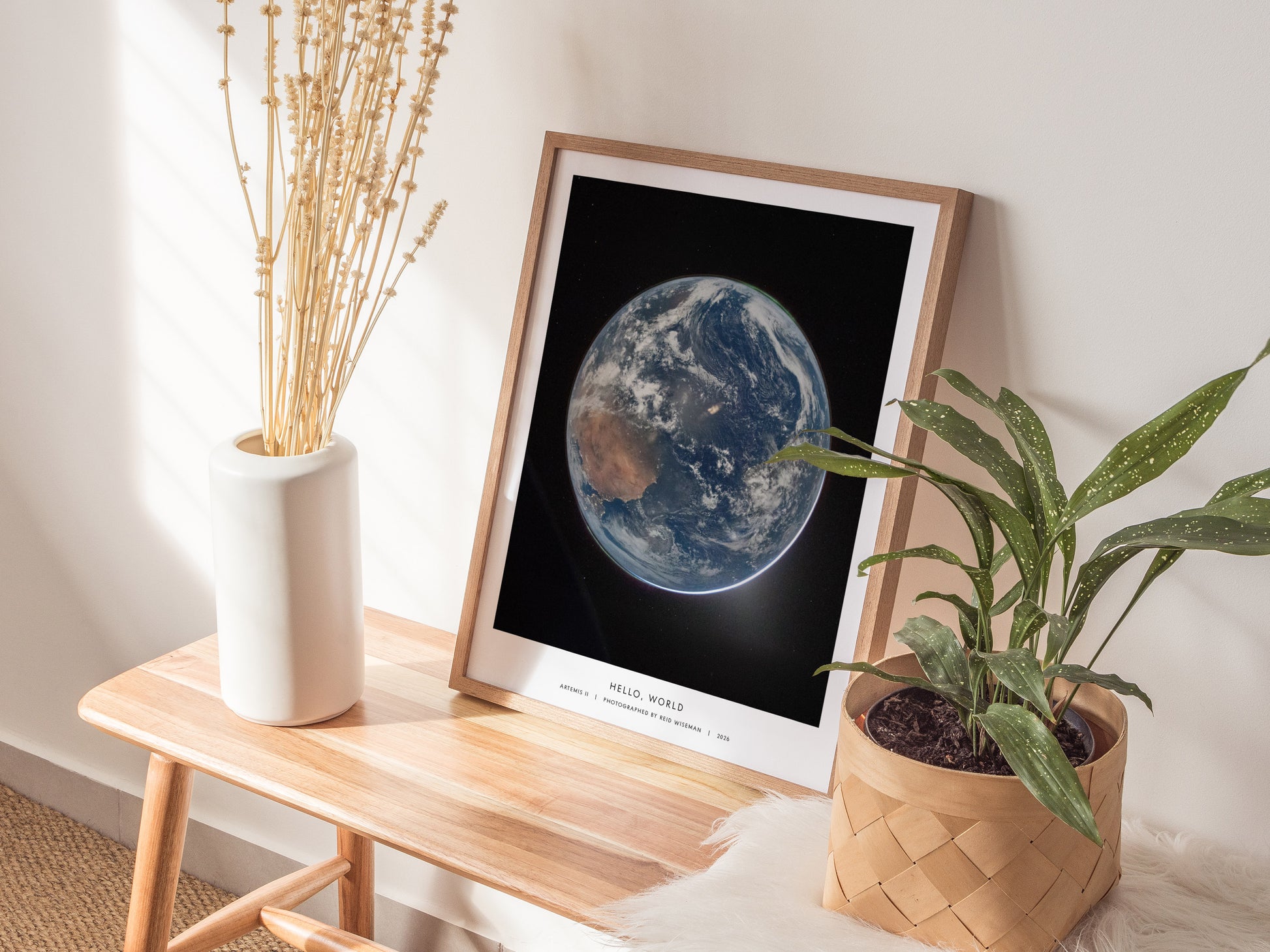 Framed poster of Earth from space, showcasing vibrant blues, greens, and whites against a black background, perfect for space art enthusiasts.