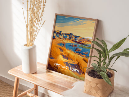 Framed retro travel print of Provincetown, showcasing vibrant houses, boats in the harbor, and golden sandy dunes.