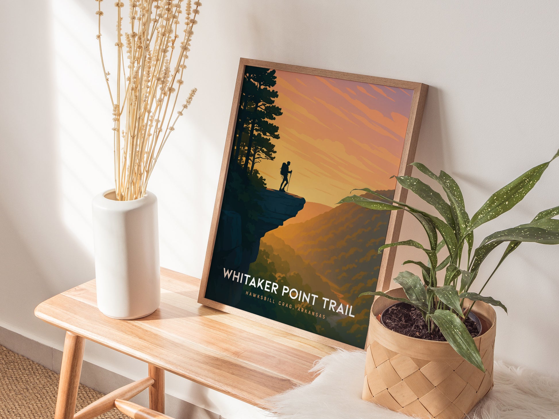 Stylized travel art poster of Whitaker Point at Hawksbill Crag, featuring a silhouetted hiker against a vibrant sunset sky.