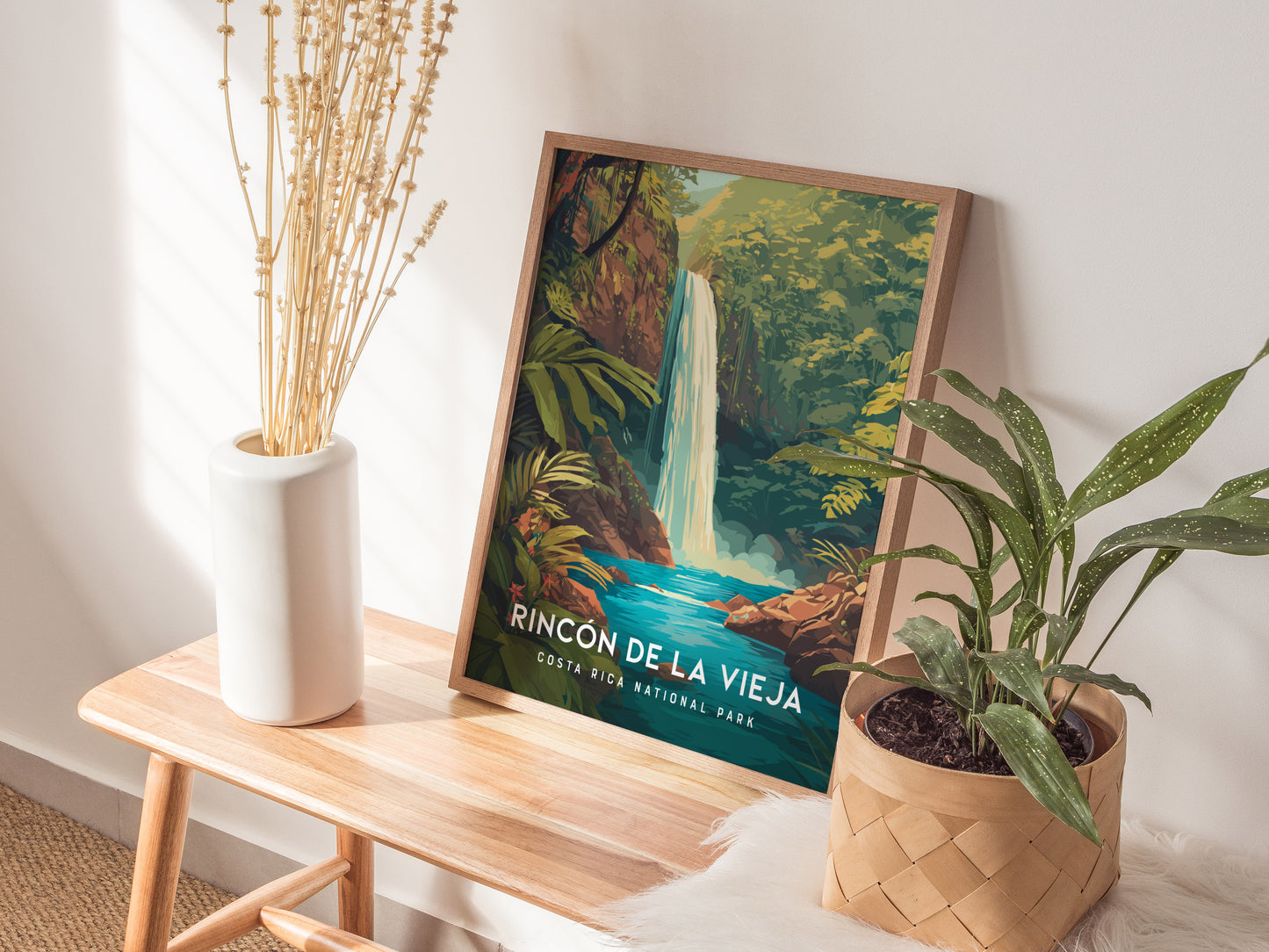 Framed print of Rincón de la Vieja waterfall, vibrant greens and blues, lush jungle backdrop, modern travel art for décor.