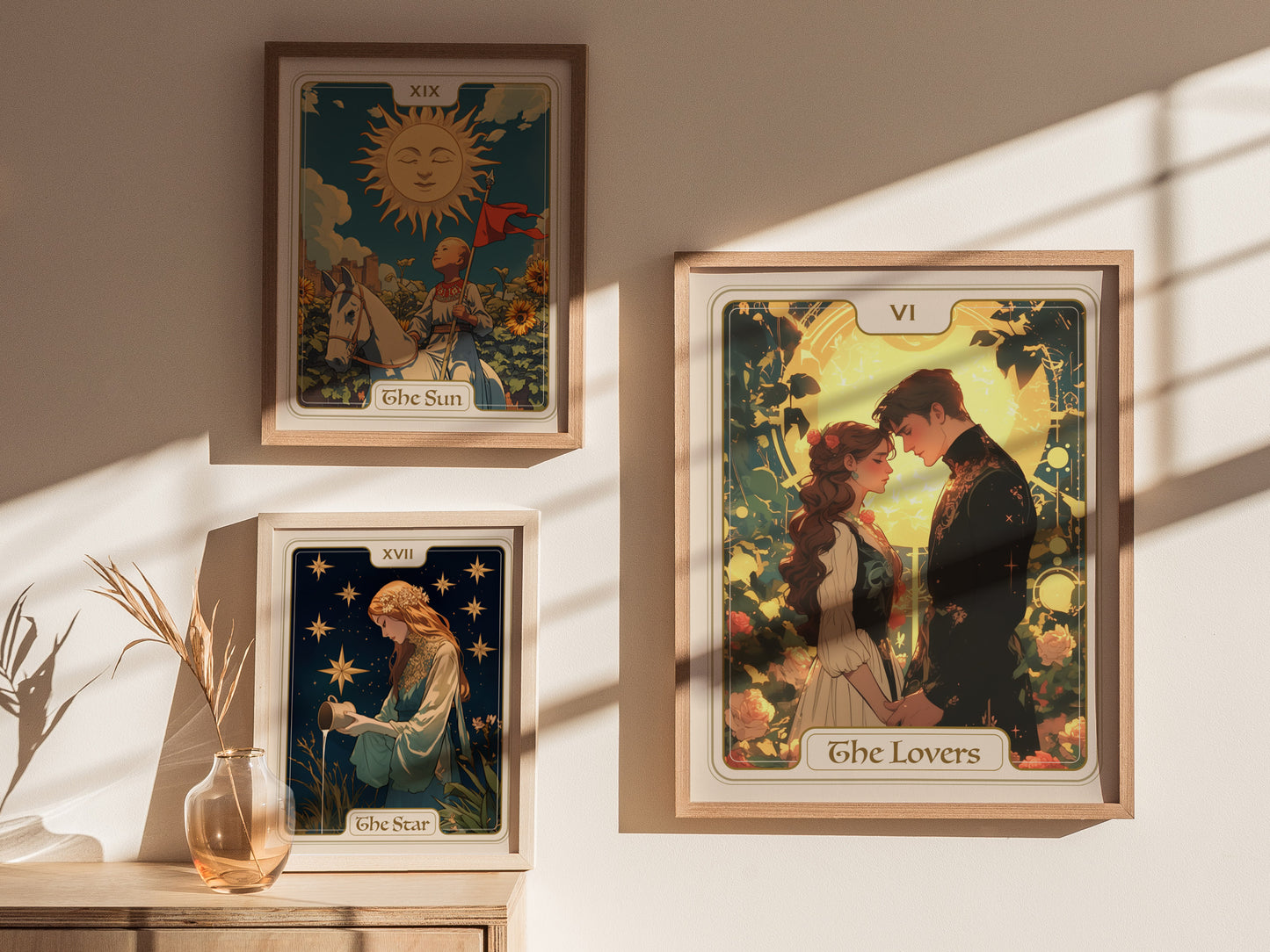 A bright room features three framed tarot card posters on a wall: The Lovers, The Sun, and The Star. The Lovers card prominently displays a couple embracing, surrounded by floral designs and a warm, golden background.