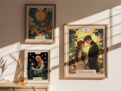 A bright room features three framed tarot card posters on a wall: The Lovers, The Sun, and The Star. The Lovers card prominently displays a couple embracing, surrounded by floral designs and a warm, golden background.