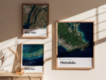 Aerial view of Honolulu, Hawaii, showcasing lush greens, blue ocean, and urban areas in a modern framed travel art poster.