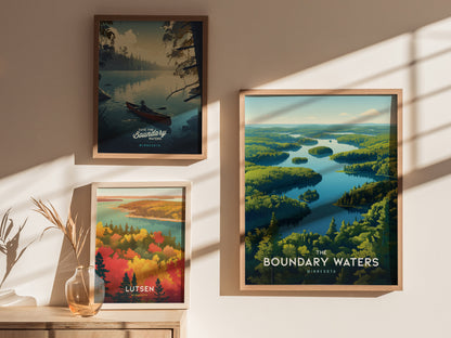 Three framed posters on a wall depict serene wilderness scenes with lakes and forests, each highlighting Minnesota locations. Sunlight casts soft shadows, creating a warm and inviting atmosphere.