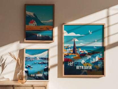 Three framed travel posters on a sunlit wall depict Icelandic scenes: a house near mountains, the Blue Lagoon, and a colorful cityscape of Reykjavík with a prominent church spire.
