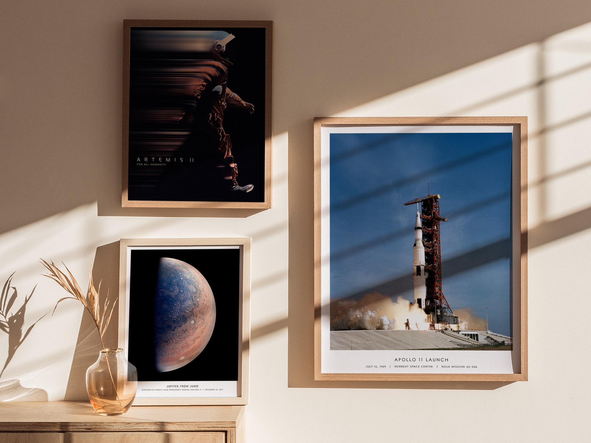 Gallery wall featuring Apollo 11 launch poster paired with Moon and Mars NASA prints