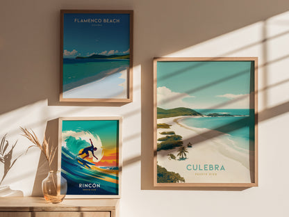 Three framed posters are displayed on a sunlit wall, featuring scenic beach art from Puerto Ricos Flamenco Beach, Culebra, and a surfing scene in Rincón.