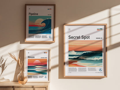 Three framed surf posters hang on a sunlit wall. Each poster features a stylized wave scene with titles: Pipeline, Rincon, and Secret Spot.