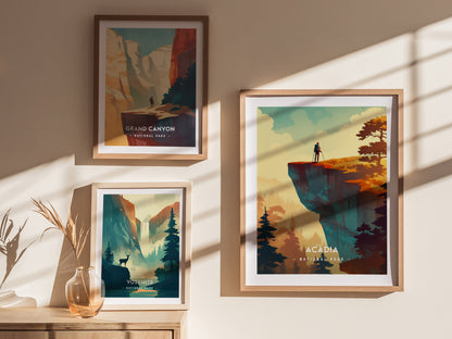 Three framed minimalist posters depict Grand Canyon, Yosemite, and Acadia National Parks. Sunlight casts shadows on the wall, enhancing the warm tones of the artwork.