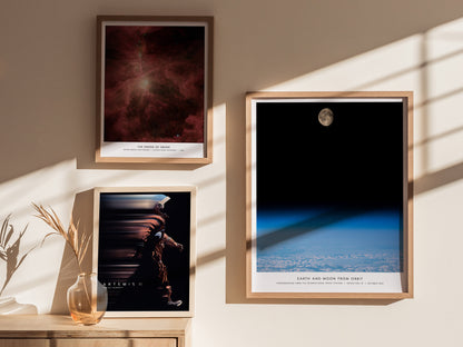Earth and Moon Orbit NASA wall art used as space themed decor in a home office or creative studio