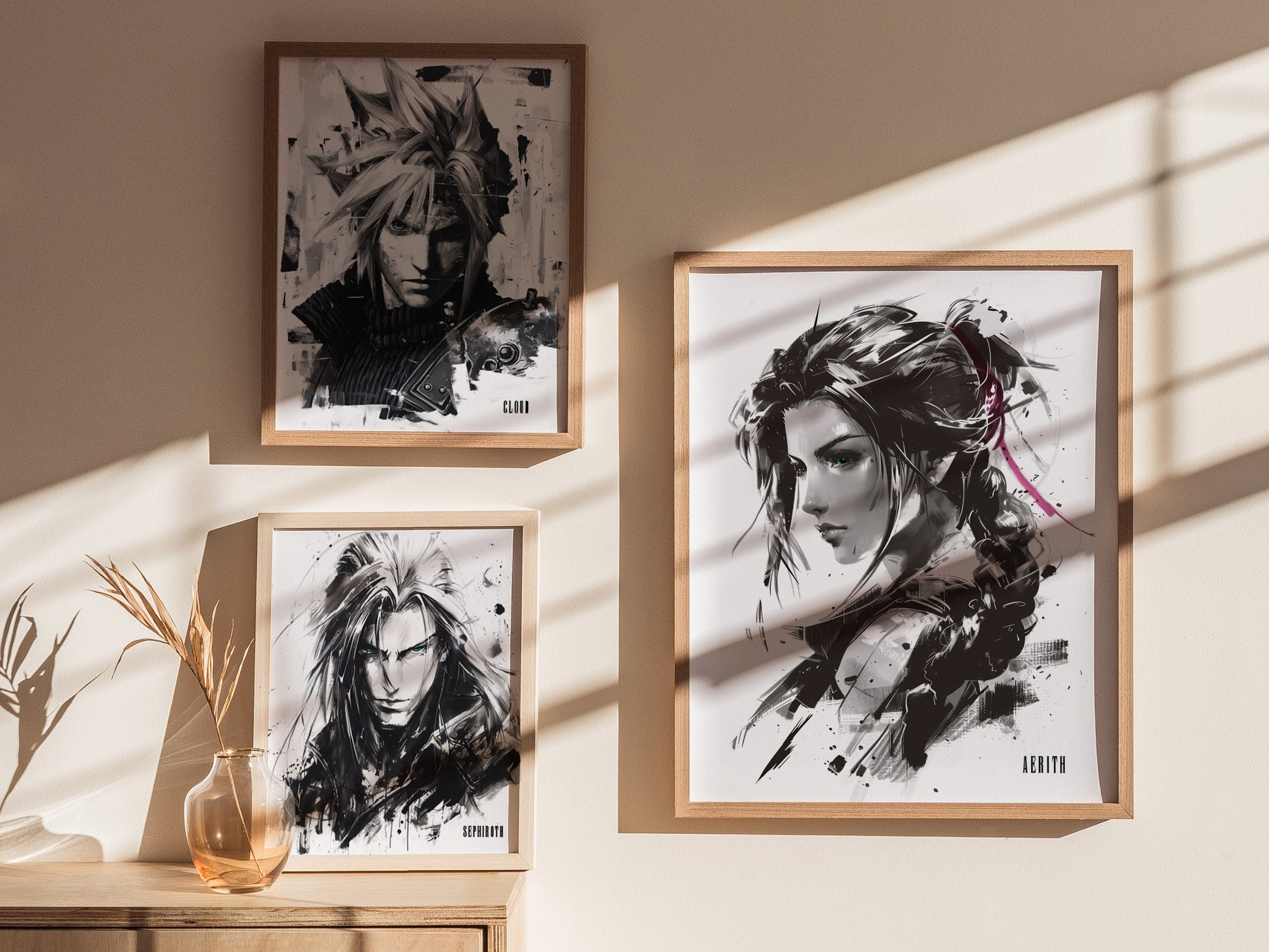 Three framed monochrome portraits are displayed on a wall, featuring stylized characters with dramatic lighting and shadows; a small vase with dried plants sits on a wooden surface.