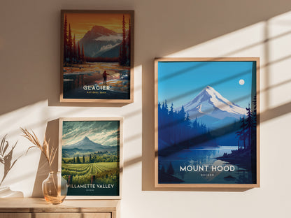 Three framed posters hang on a sunlit wall, featuring Mount Hood, Glacier National Park, and Willamette Valley. A glass vase with dried plants is placed below.