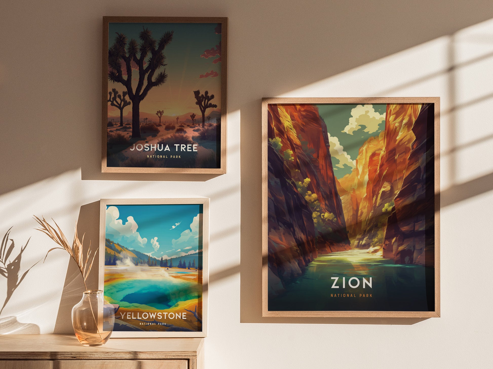 Three framed posters depicting national parks hang on a sunlit wall. Featured are Zion, Joshua Tree, and Yellowstone, each showcasing vibrant landscapes and natural beauty.