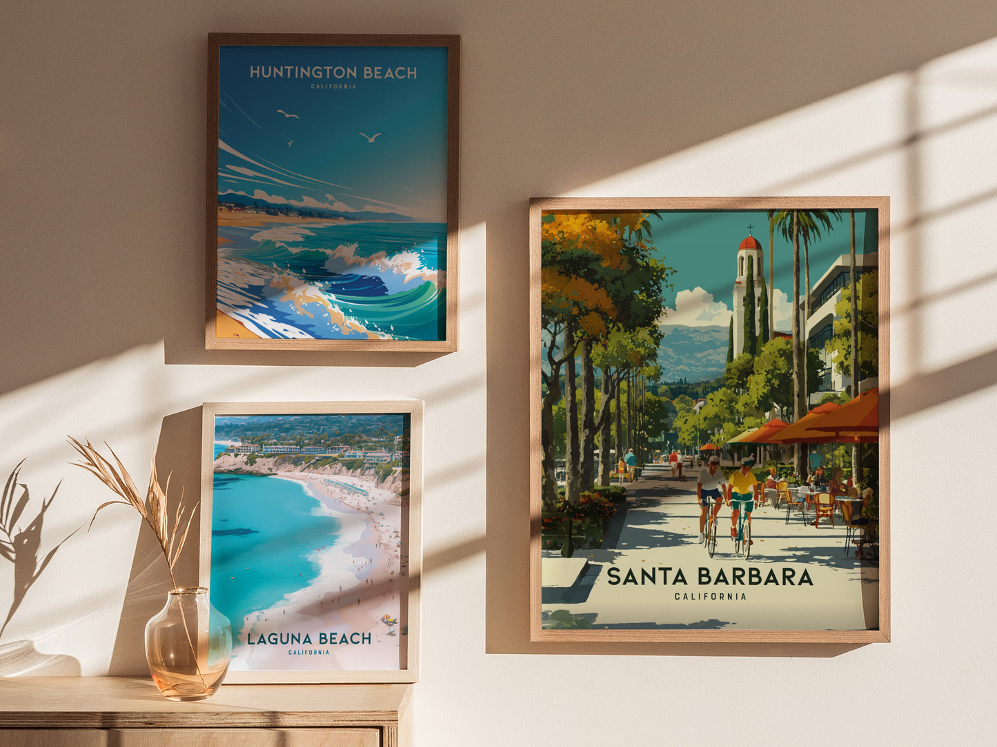 Framed posters of Huntington Beach, Laguna Beach, and Santa Barbara on a wall.
