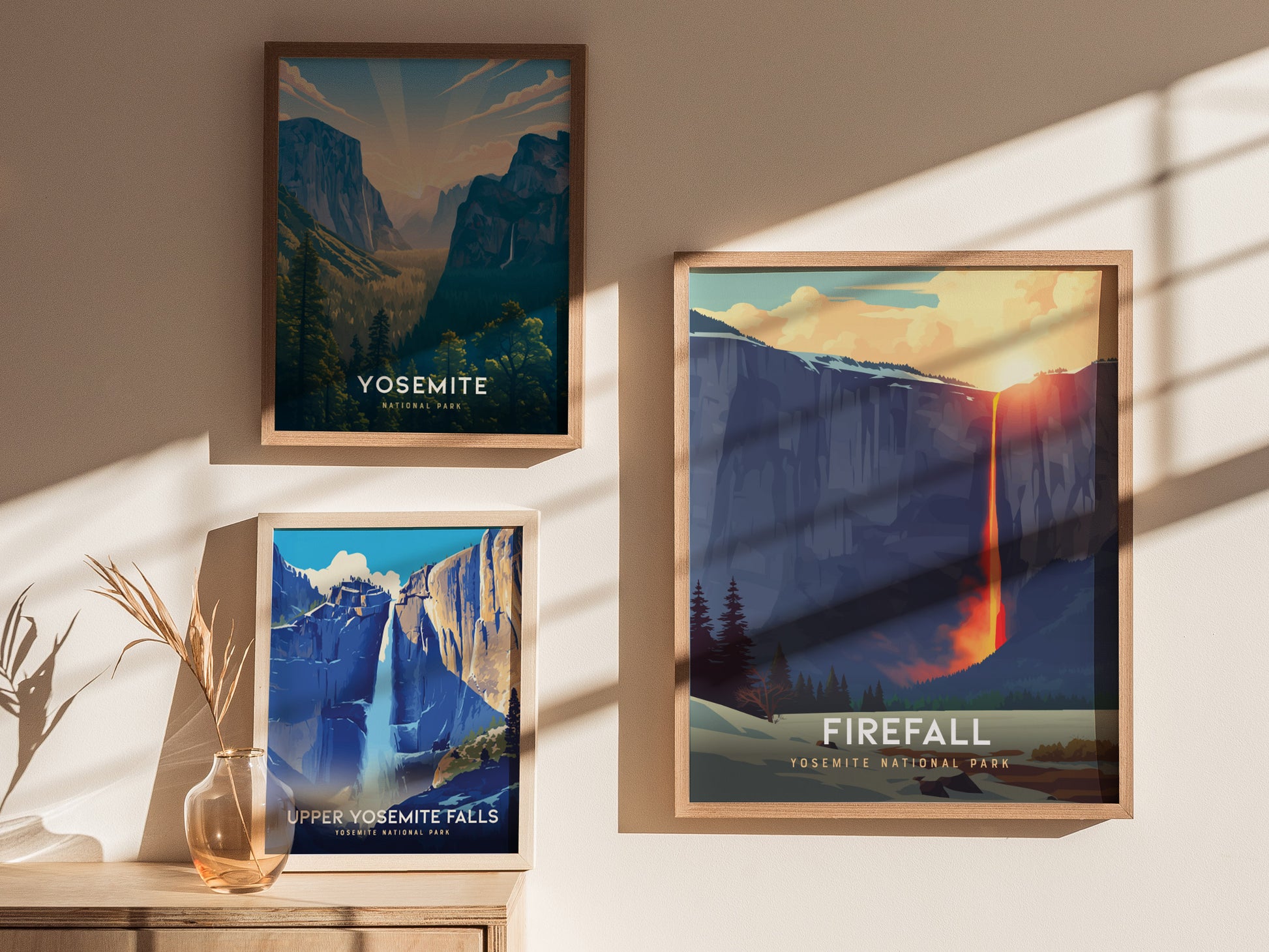 Three framed posters of Yosemite National Park on a wall with sunlight casting shadows.