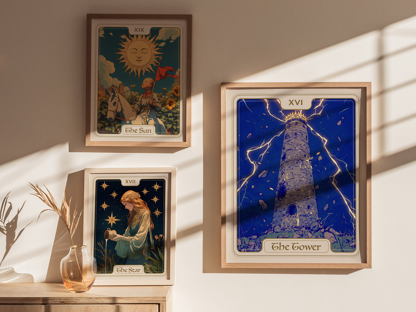 A stylish interior display featuring three framed tarot card posters on a light-colored wall. The prominent poster titled The Tower depicts a lightning-struck tower against a vibrant blue background, surrounded by artistic embellishments.