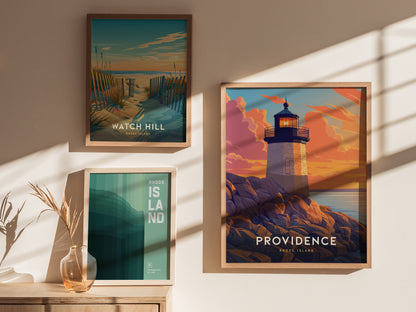 Three framed posters are displayed on a wall, featuring scenic views of Rhode Island, including a lighthouse at sunset, a coastal path, and minimalist text design.