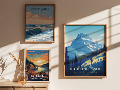 Three framed posters are displayed on a sunlit wall, featuring scenic landscapes of Outer Banks, Acadia National Park, and the Highline Trail in Glacier National Park.