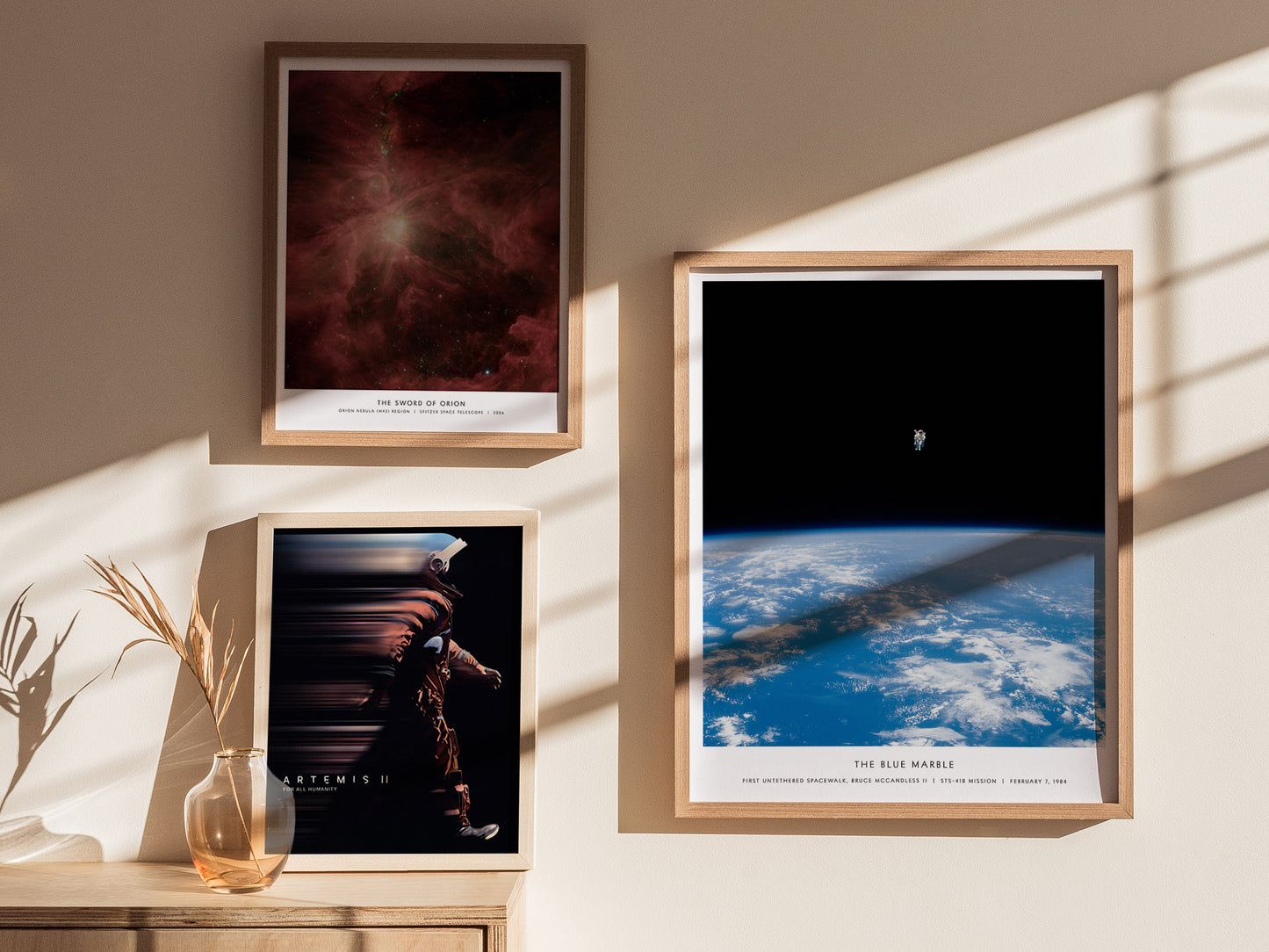 Gallery wall featuring the Blue Marble NASA spacewalk poster paired with other NASA mission prints