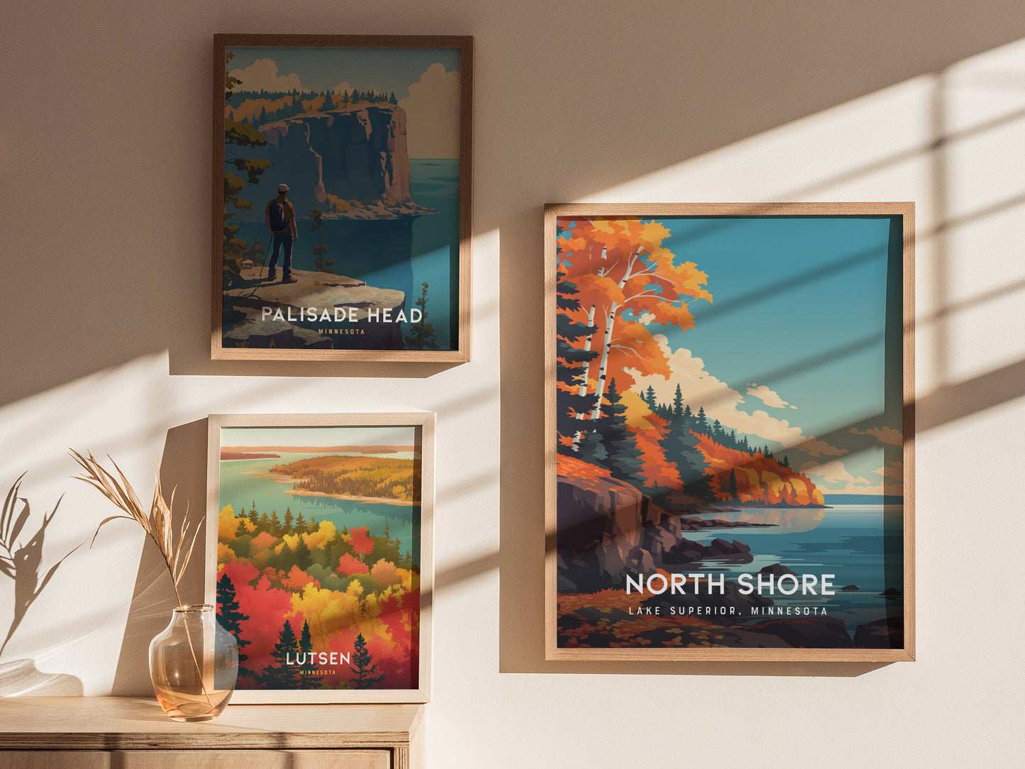Three framed art prints are displayed on a wall, showcasing scenic views of the North Shore of Lake Superior, Minnesota.