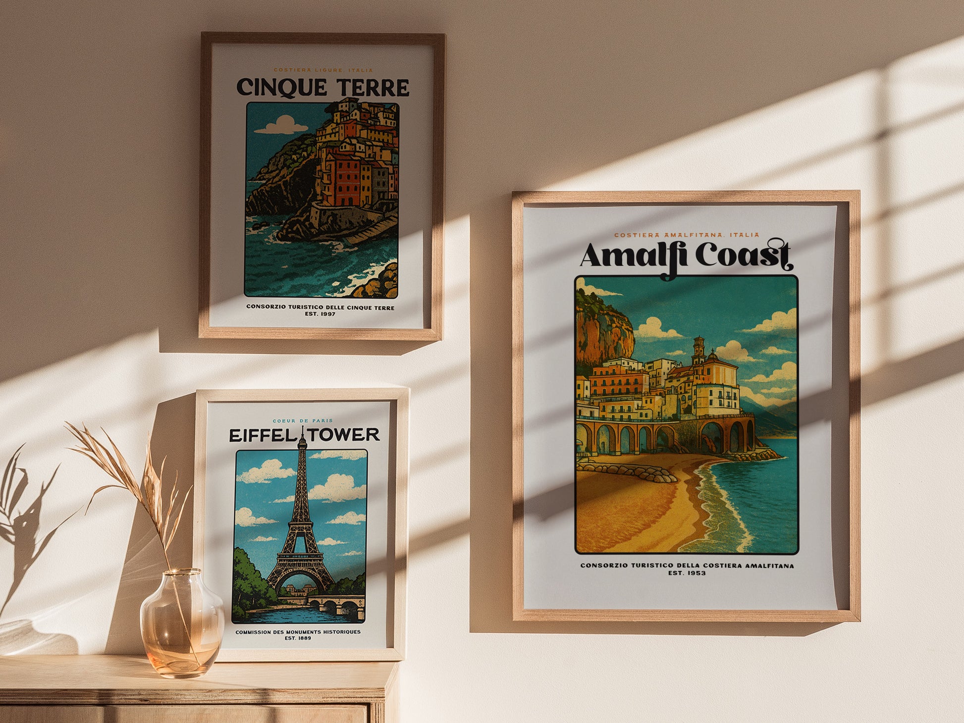 Gallery wall featuring the Amalfi Coast vintage travel poster alongside other Italy and European city prints