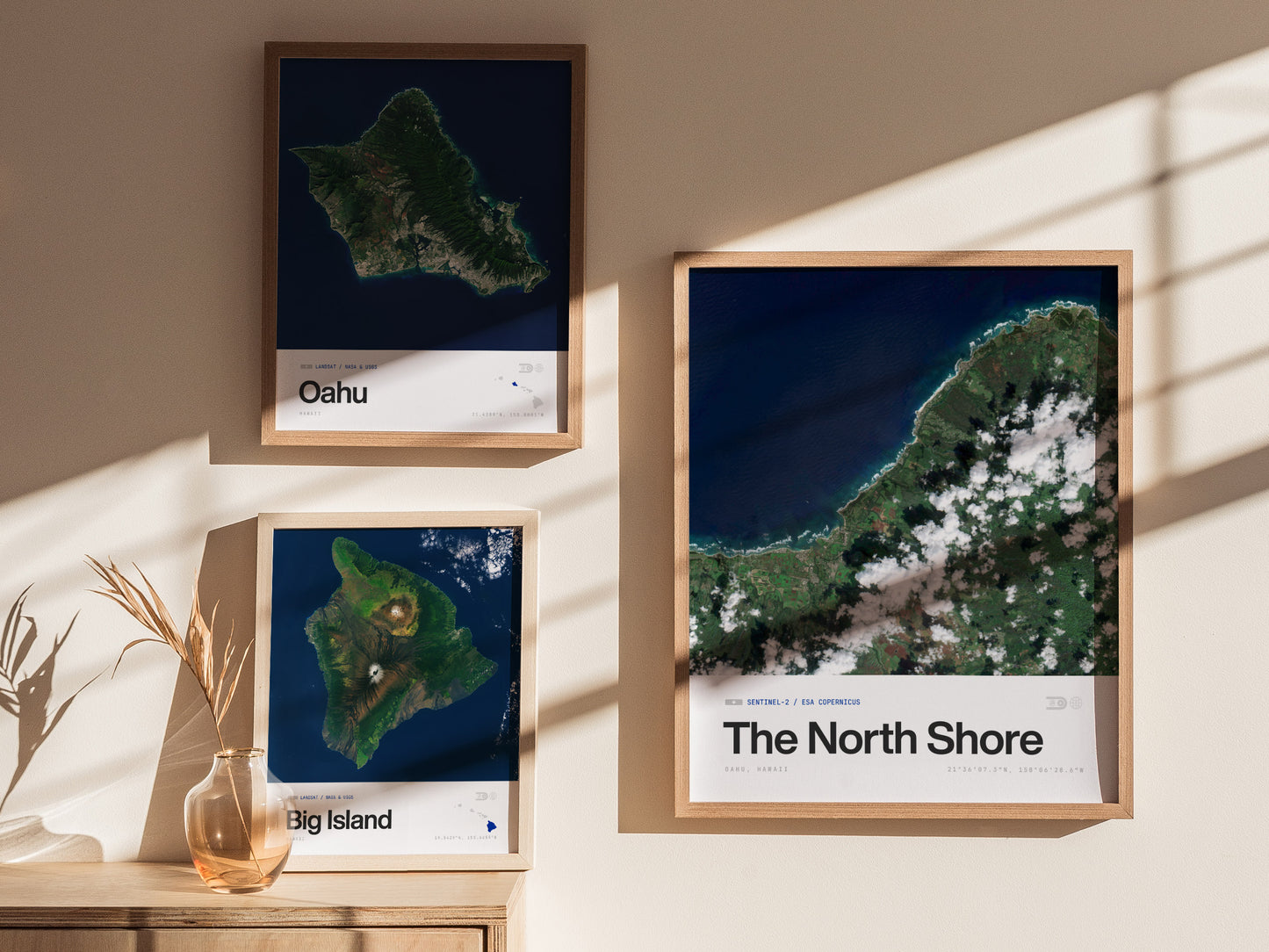 Framed satellite print of Oahu's North Shore showcasing a vibrant blue ocean, green coastline, and white clouds, perfect travel art.