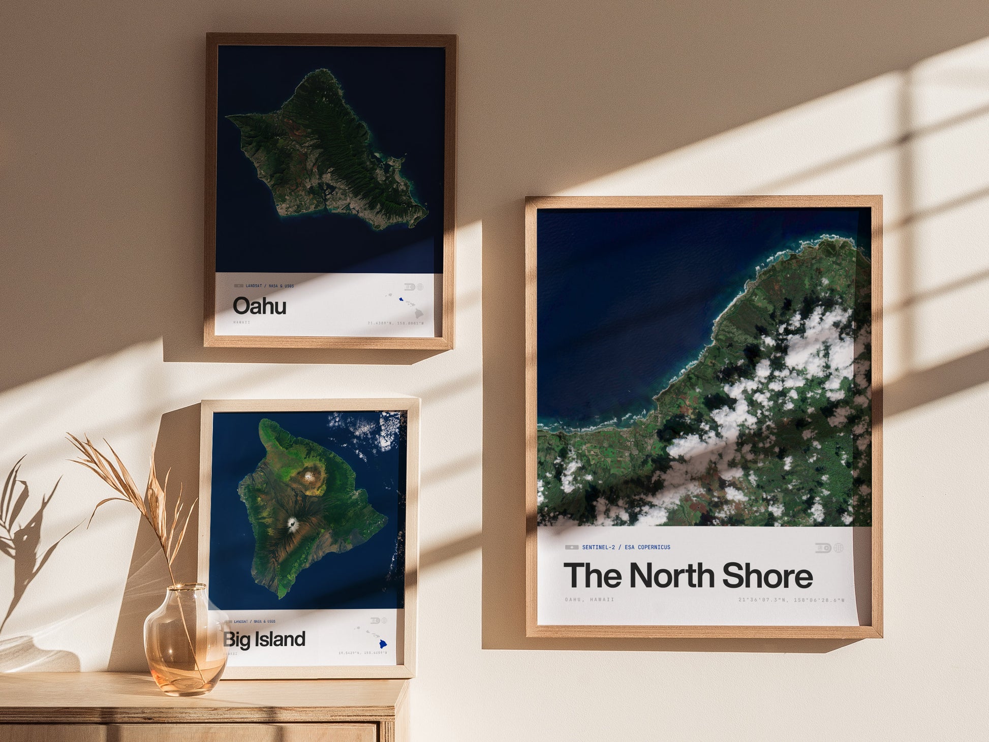 Framed satellite print of Oahu's North Shore showcasing a vibrant blue ocean, green coastline, and white clouds, perfect travel art.