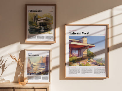 Three framed posters on a sunlit wall depict Fallingwater, Taliesin West, and the Guggenheim Museum. A glass vase with dried plants sits on a wooden surface below.