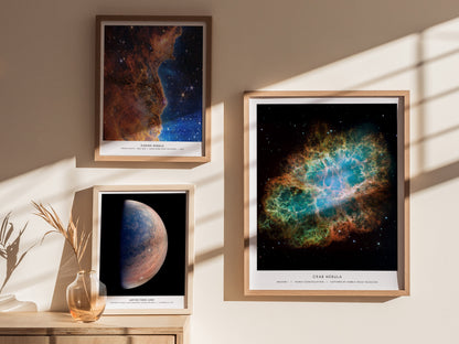 Gallery wall featuring the Crab Nebula poster paired with other NASA space prints in matching wood frames.