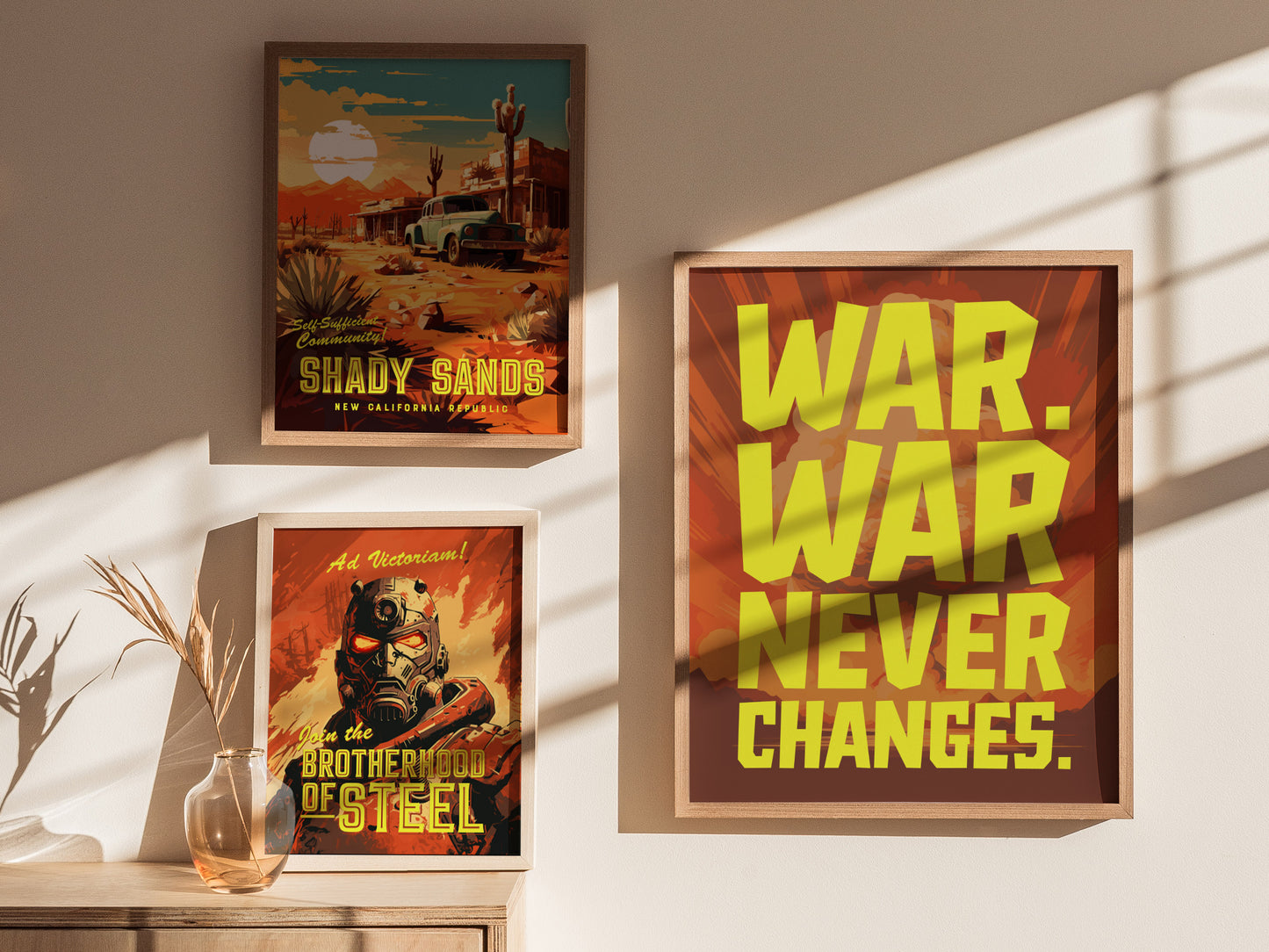 Three framed posters are displayed on a wall, featuring bold yellow text saying WAR. WAR NEVER CHANGES. and scenes from a desert and futuristic warrior.