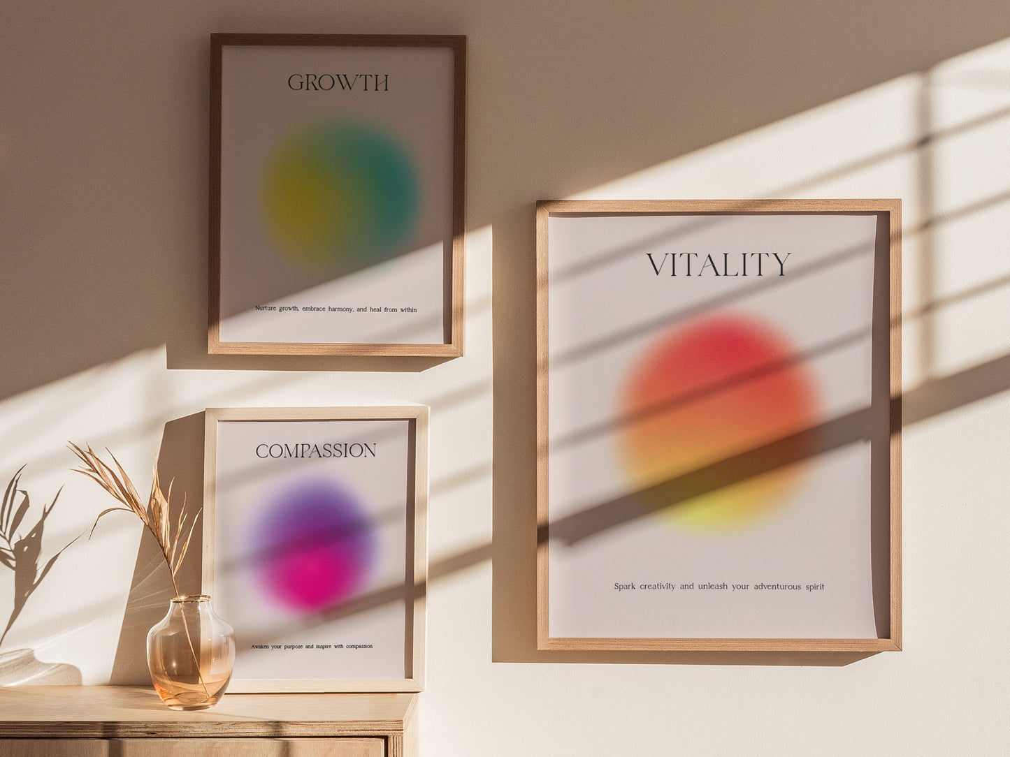 Three framed prints on a wall with abstract designs and text.