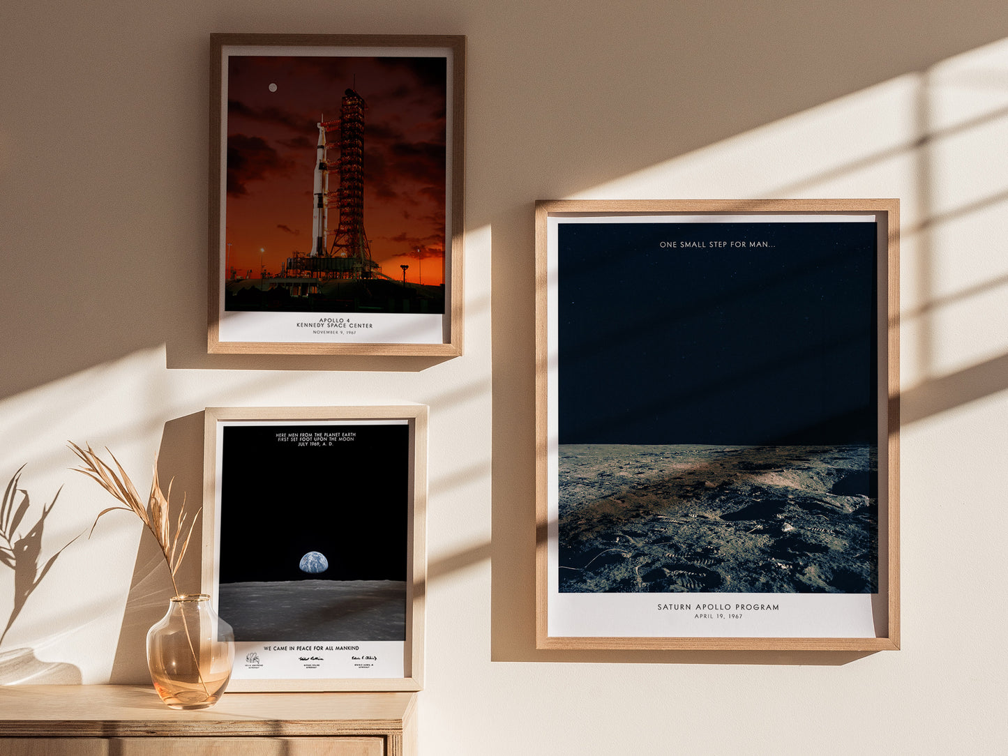 Gallery wall featuring Apollo 12 Moon Landing poster paired with Saturn V and Apollo mission prints
