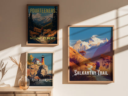 Three framed posters are displayed on a sunlit wall, featuring Mount Elbert, Split Rock Lighthouse, and the Salkantay Trail with vibrant landscapes and colorful illustrations.