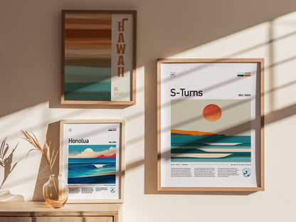 Three framed posters on a sunlit wall display minimalist beach and surf art, featuring locations in Hawaii, including S-Turns and Honolua, with warm.